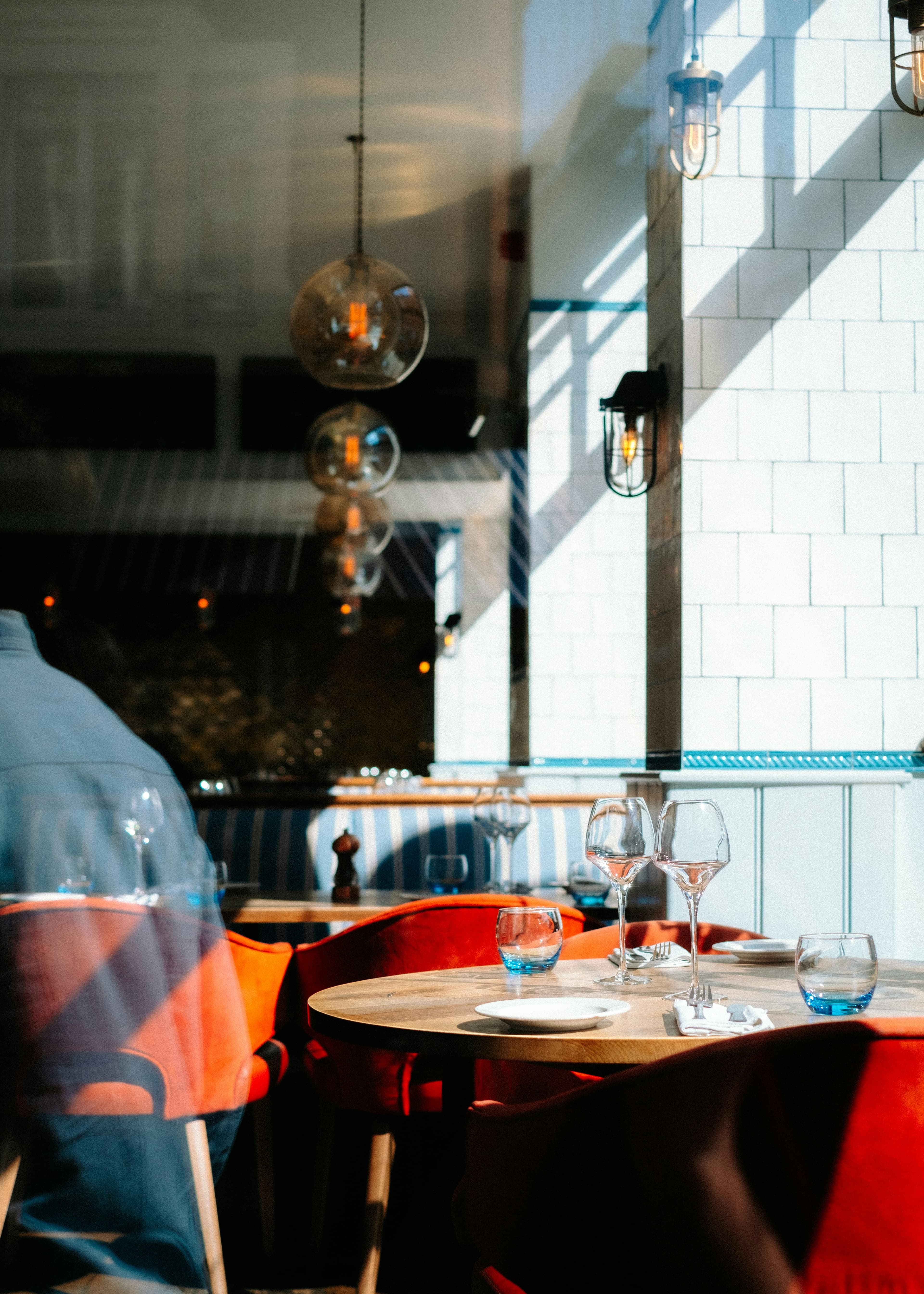 A narrow room of twelve tables