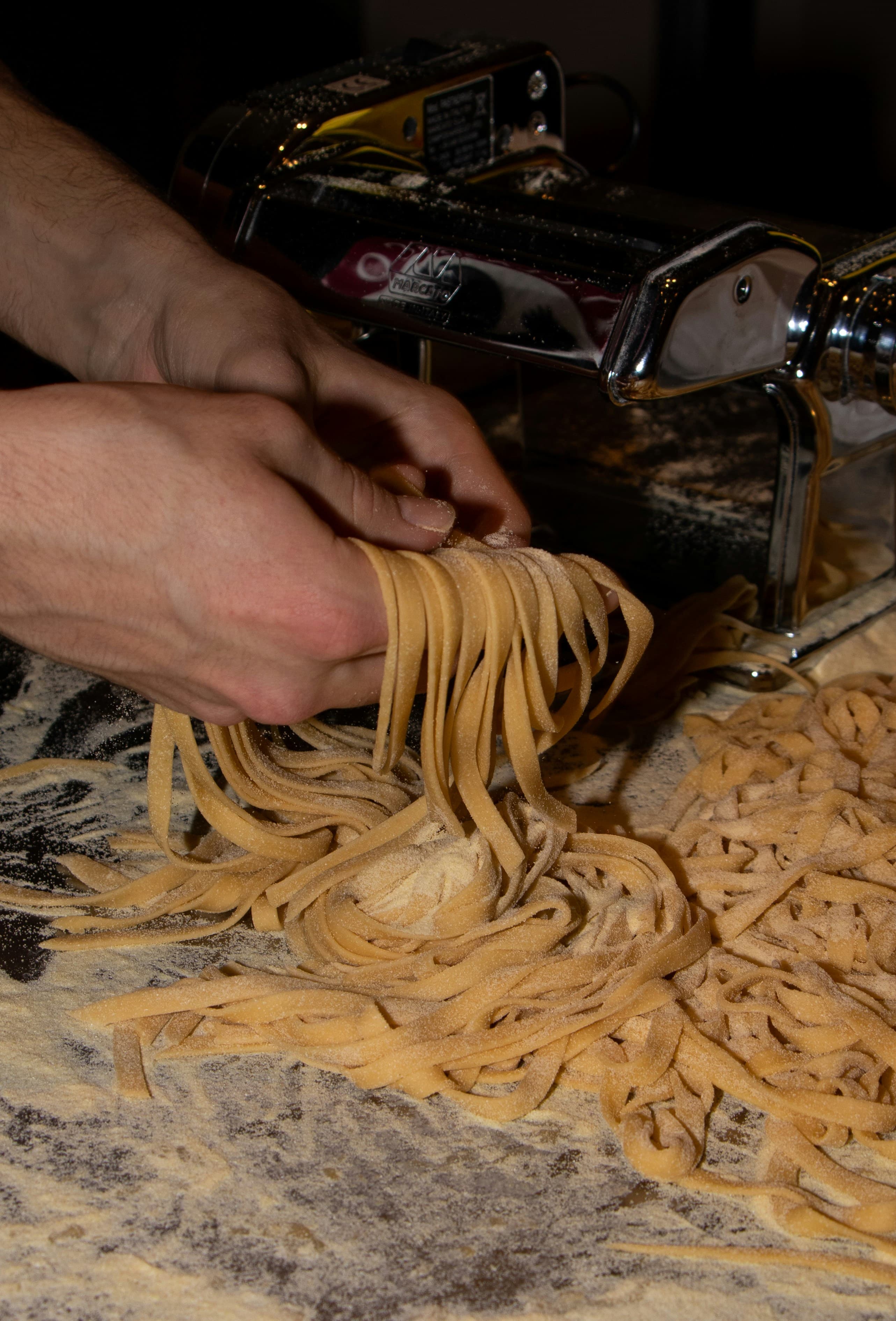 Dough folded and pressed on a worn pasta board
