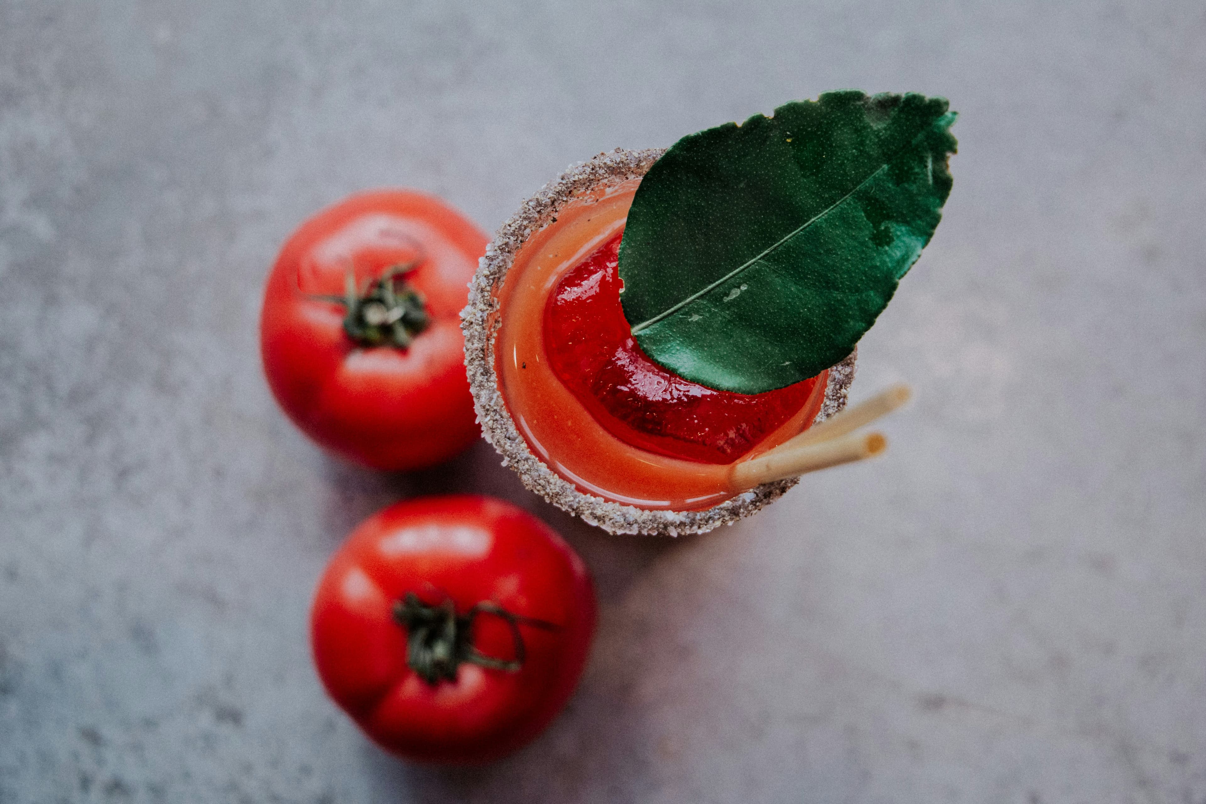 Vine tomatoes and basil on bare wood