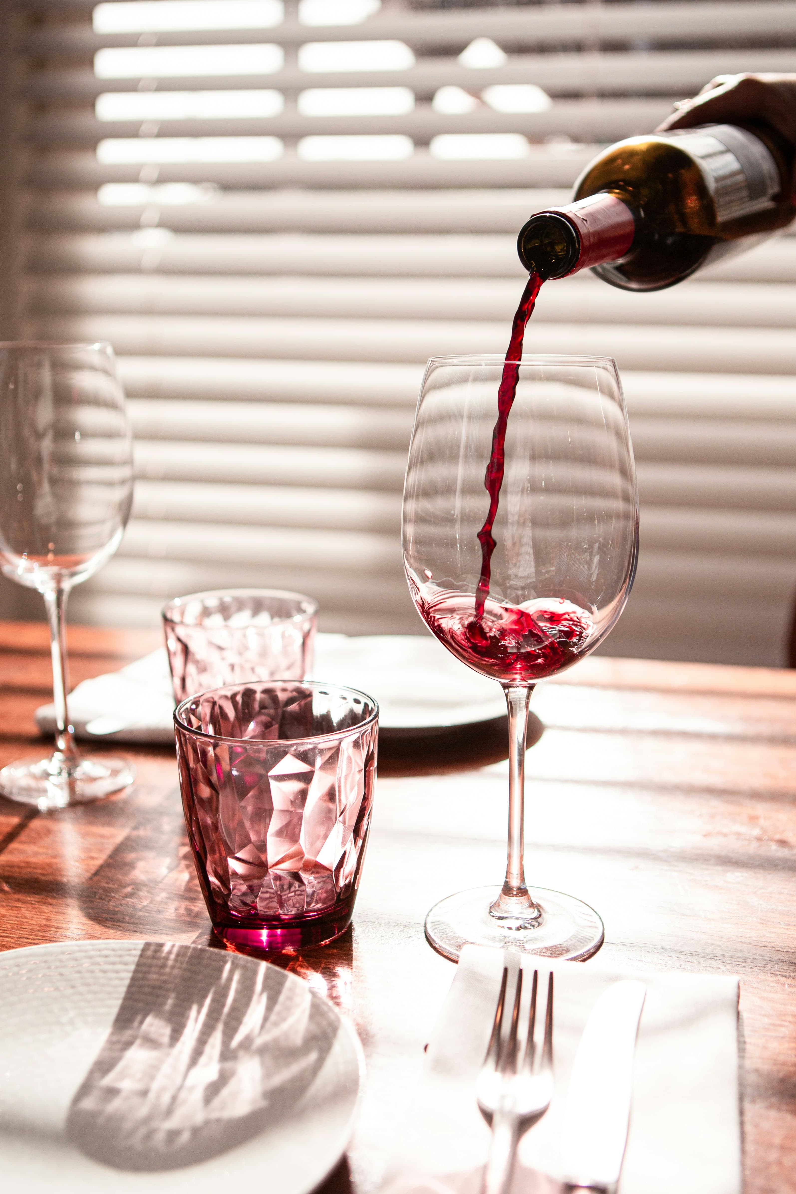 Glasses lined along the bar before service